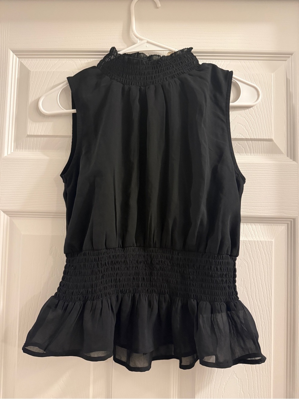 Japna Black Sleeveless Smocked Peplum Top